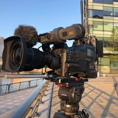Broadcast camera on tripod